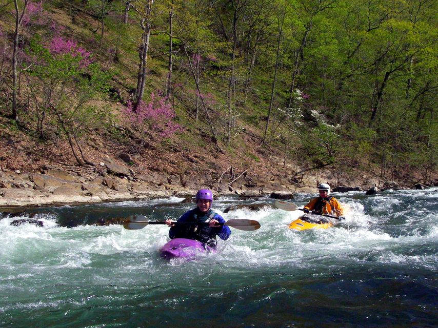 Kayakers running a rapid on the North Fork